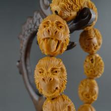 高海 金刚猴头手串橄榄核雕