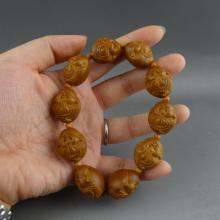 苏工春洁铁核橄榄核雕一心向佛手串