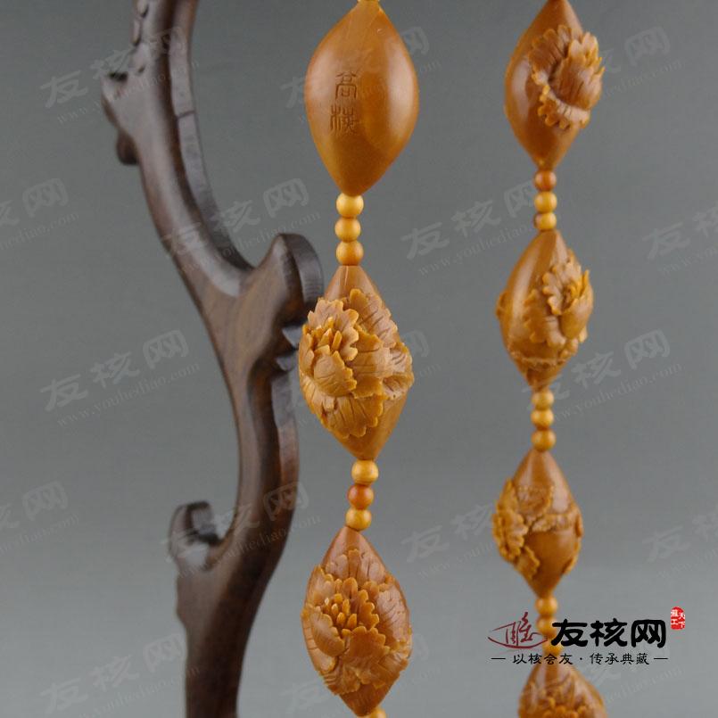 高梅 凤穿牡丹长串橄榄核雕 落款